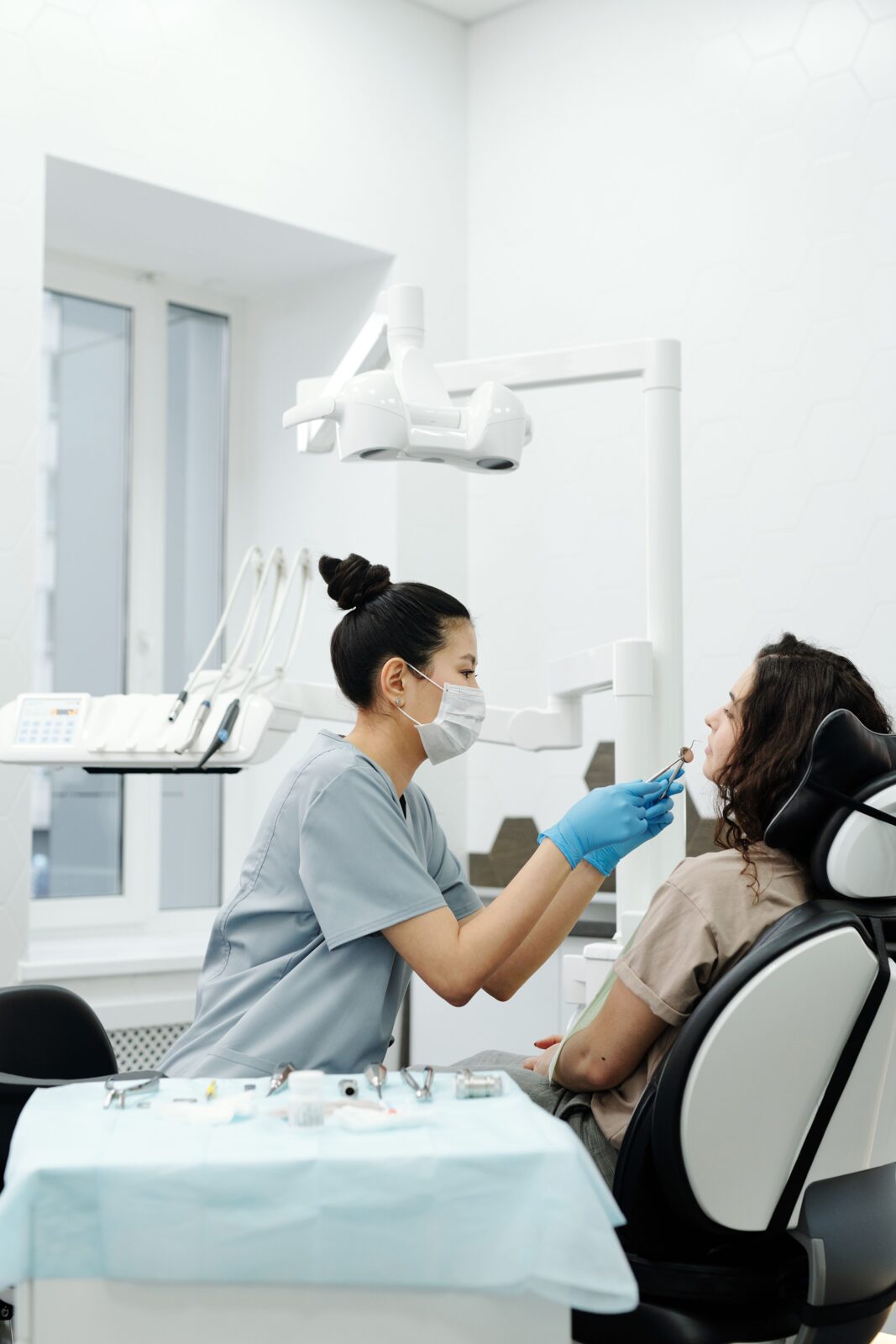 A Desert Oral Surgery clinician treating a patient in the operatory